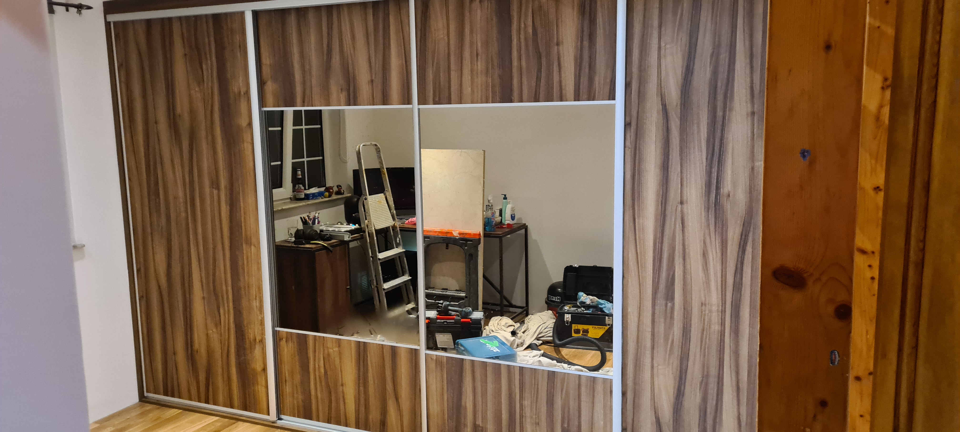Made to measure walnut sliding wardrobe